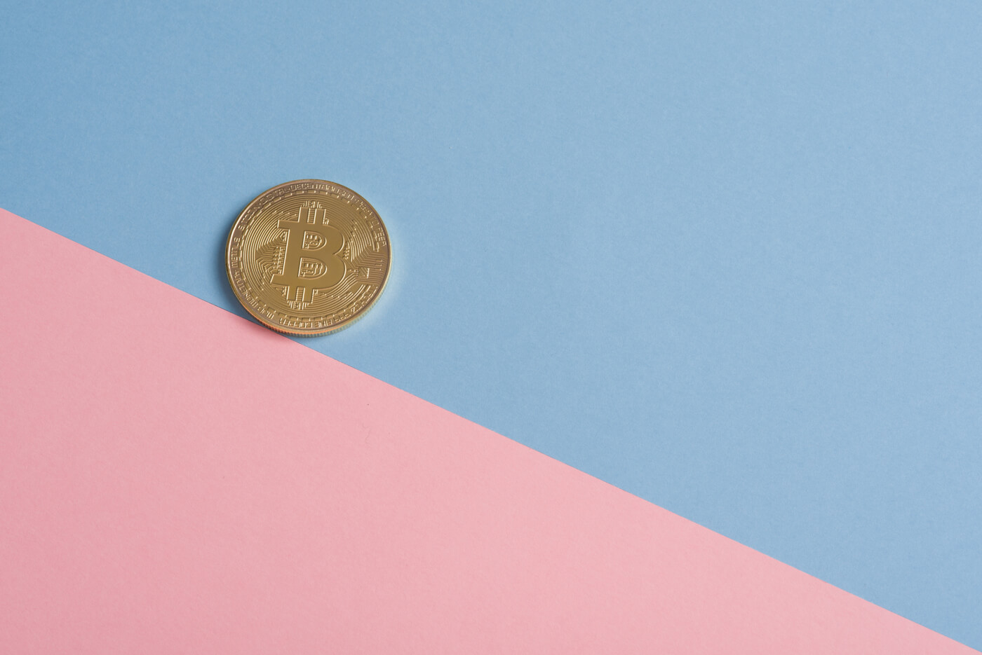  a coin on blue and pink background