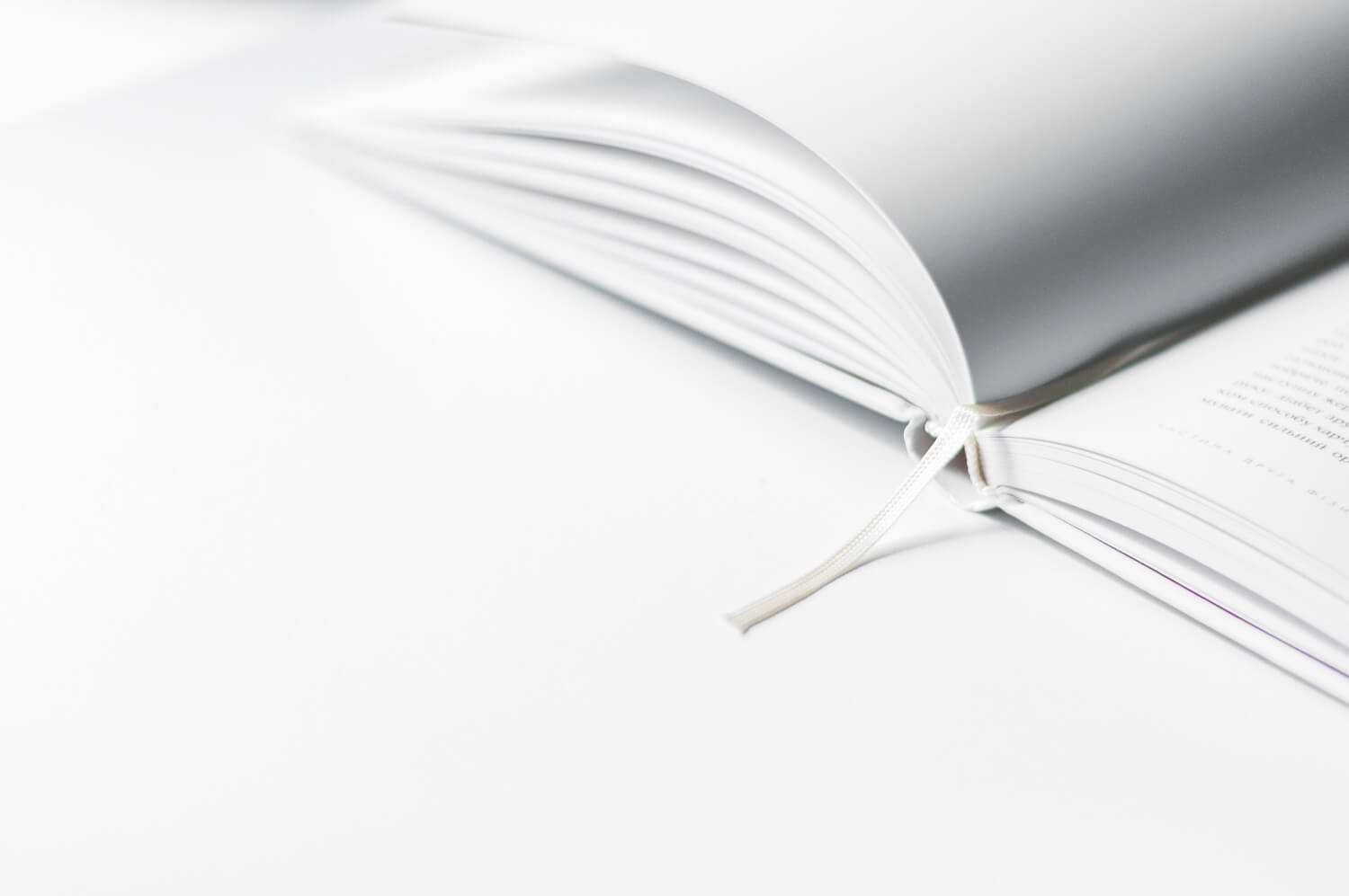 an open white book on a white background